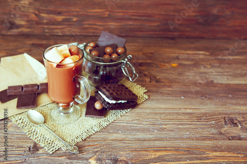 Fotografie, Obraz Homemade brown sweet chocolate cocktail on wooden table