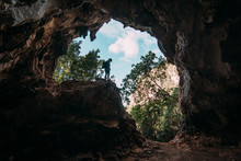 Traveler Inside Of Natural Cave