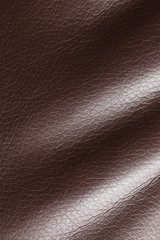 Brown leather material as an abstract background