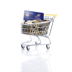 Shopping cart filled with money and credit card