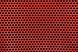 Red metal background with round holes.