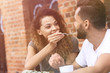 © ASDF - Young couple enjoying coffee at a street cafe and  laughing