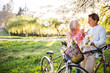 © Halfpoint - Beautiful senior couple with bicycles outside in spring nature.