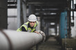 © ReeldealHD images - Industrial worker checking pipeline
