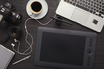 designer workplace with graphic tablet and laptop