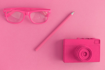 Pink objects on pink background minimal creative photography concept.