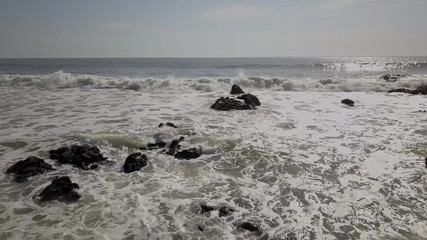 Sticker - Drone video footage of waves hitting the rocks at seashore