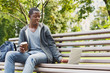 © Prostock-studio - Sad young man using laptop outdoors