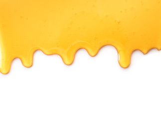 Wall Mural - dripping honey isolated on white background