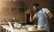 © Prostock-studio - African-american man baking cookies at home kitchen