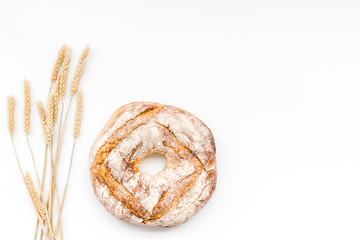 Wall Mural - Home bread with classic recipe. Round loaf on white background top view copy space