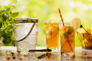 Wall Mural - Iced tea with lemon and ice cubes