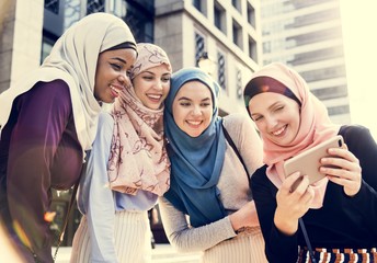 Wall Mural - Group of islamic women taking selfie together