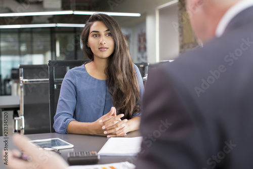 Fotografía Focused Indian female customer meeting with financial advisor