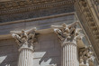 Close-up of decorative capital and frieze on the Maison Carrée's columns, an ancient Roman temple, in the city center of Nimes. Located in the Gard department, Occitanie region in southern France