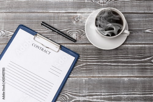 Fotografia, Obraz ccup of coffee, pen, contract form on a wooden background