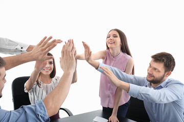 Poster - People giving high five over table. Unity concept