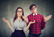 © Feodora - Dubious couple shrugging with shoulders