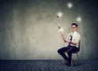 © Feodora - Man juggling with glowing light bulbs