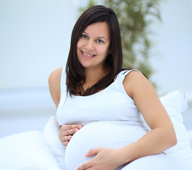 Wall Mural - portrait of a happy pregnant woman.