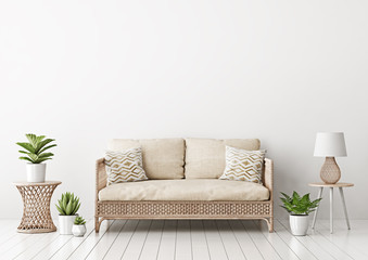 Home interior mock up with wicker rattan sofa, beige pillows, lamp and green plants in living room with empty white wall. 3D rendering.