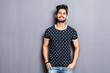 © F8  \ Suport Ukraine - Indian man in t-shirt over gray background