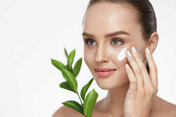 Beauty Face Care. Woman With Cream On Facial Skin