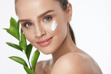 Beauty Face Care. Woman With Cream On Facial Skin