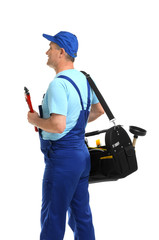 Wall Mural - Mature plumber with pipe wrench and tool bag on white background