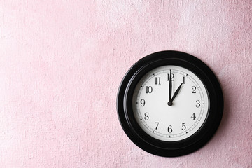 Poster - Big black clock on color background. Time change concept