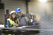 © goodluz - Metalworker and engineer meeting in factory