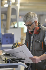 Canvas Print - Woodwork technician programming sawmill machine