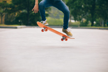 Wall Mural - Skateboarder sakteboarding on parking lot