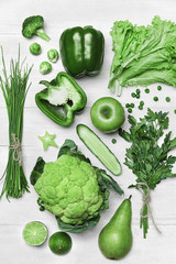 Canvas Print - Food Background. Green Vegetables And Fruits On Wooden Table