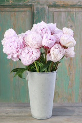 Canvas Print - Bouquet of pink peonies in vintage bucket.