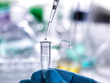 © Connect Images - Scientist pipetting sample into vial for laboratory experiment