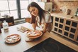 Young woman baking delicious pizza to her family and friends. Cooking with love, homemade recipe, culinary, food preparing concept