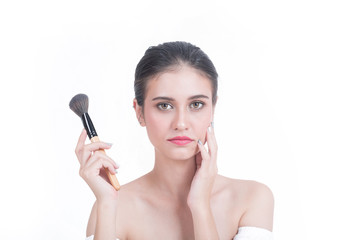 Young beautiful woman with Makeup brush isolated on white backgound.