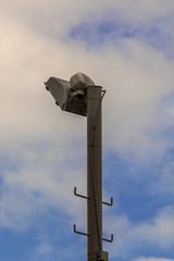 Searchlight on blue sky background