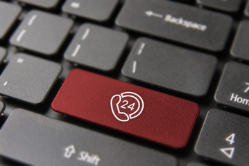 Wall Mural - 24 hour service button on computer keyboard for 24/7 always online concept. laptop key in red color 