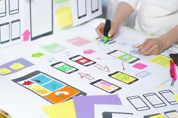 designing application for mobile phone. the specialist creates a prototype user experience interface