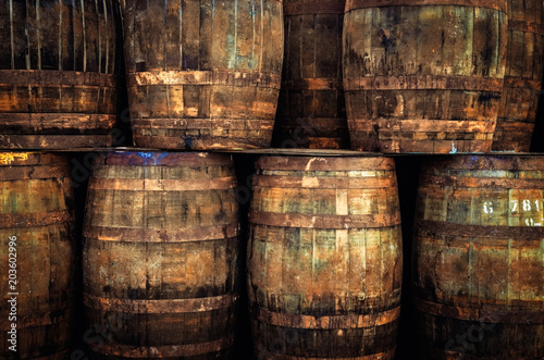 Fotomural Detail of stacked old wooden whisky barrels