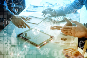 Three business people with busy meetings in the office. On the table are computers, tablets and notebooks. There are many icons floating around them.