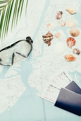 Naklejka na meble top view of diving mask with seashells and flight tickets on travel map