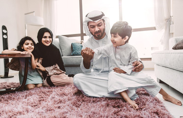 Wall Mural - Arabic happy family lifestyle moments at home
