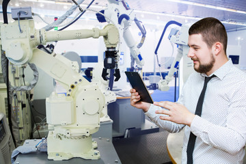 Aufkleber - Engineer with tablet. Programming robot with robotic arm. Smart factory 