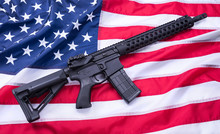Custom Built AR-15 Carbine On American Flag Surface, Background. Studio Shot.