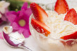 © tetxu - glass bowl of strawberries with cream with spring background