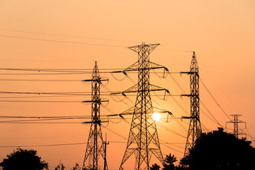 silhouette high voltage pole on sky sunset background.