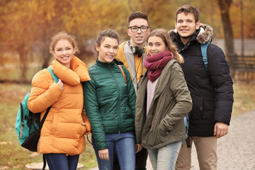  Group of cheerful teenagers outdoors